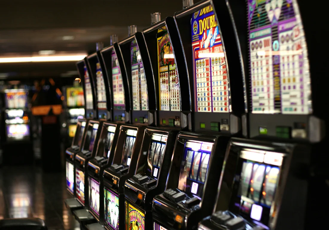 A row of screen-based gaming machines in Las Vegas