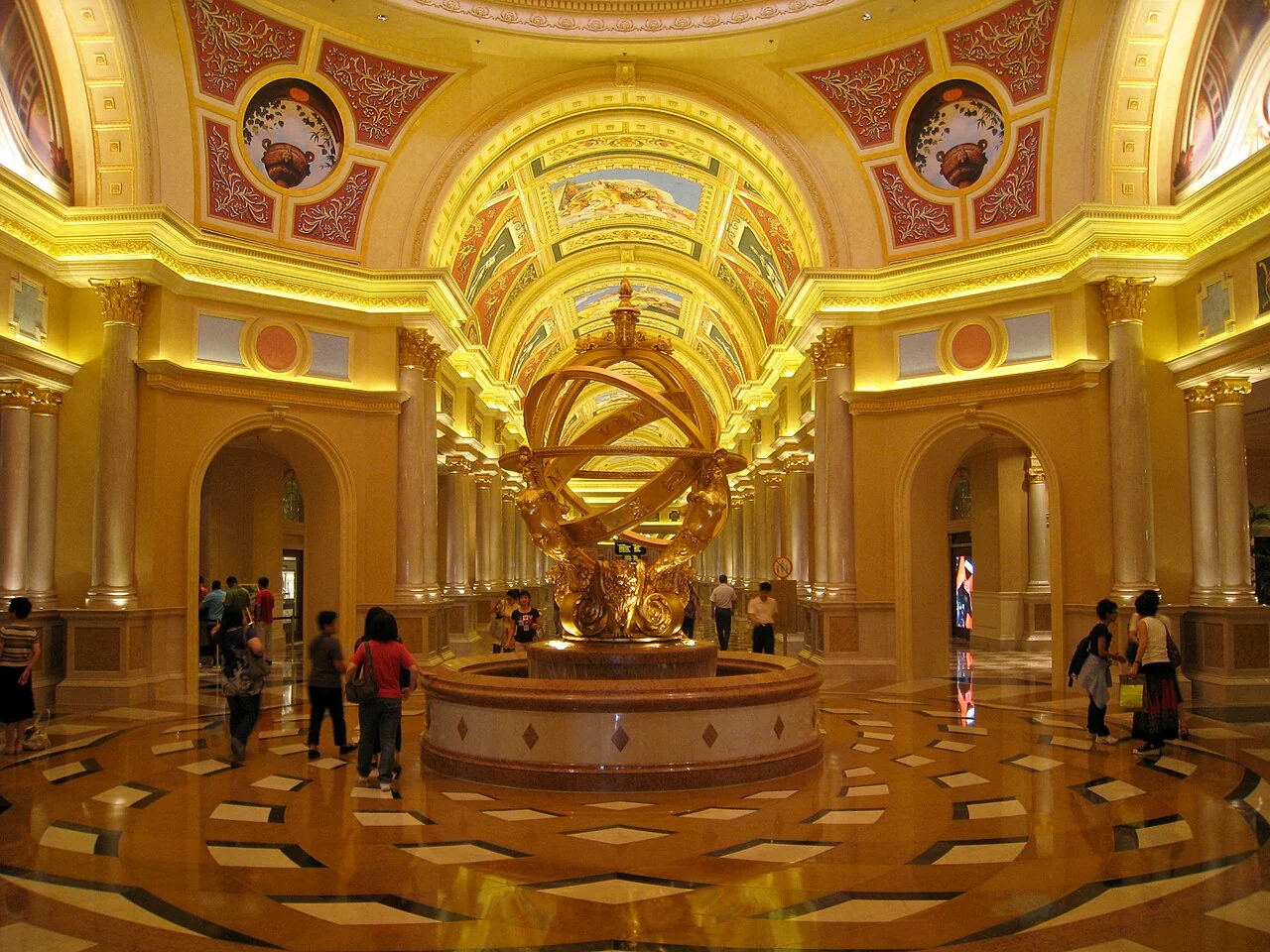 The ornate entrance lobby and golden armillary sculpture at The Venetian Macao